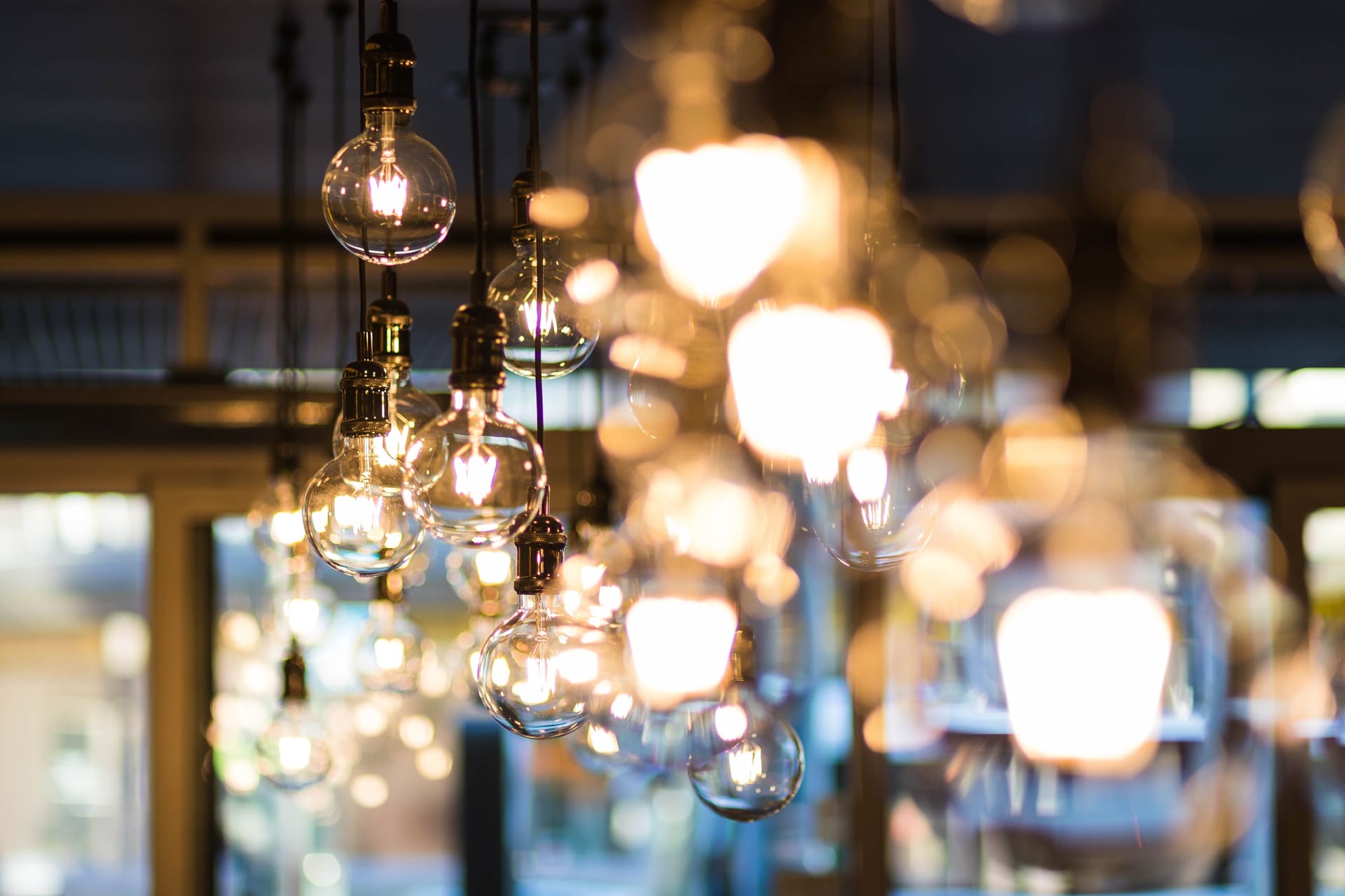 A collection of glowing glass pendant lights