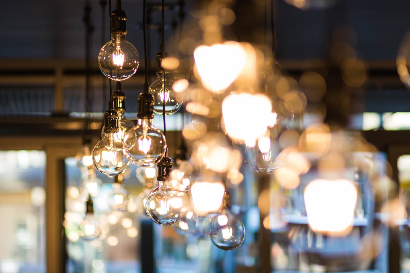 A collection of glowing glass pendant lights