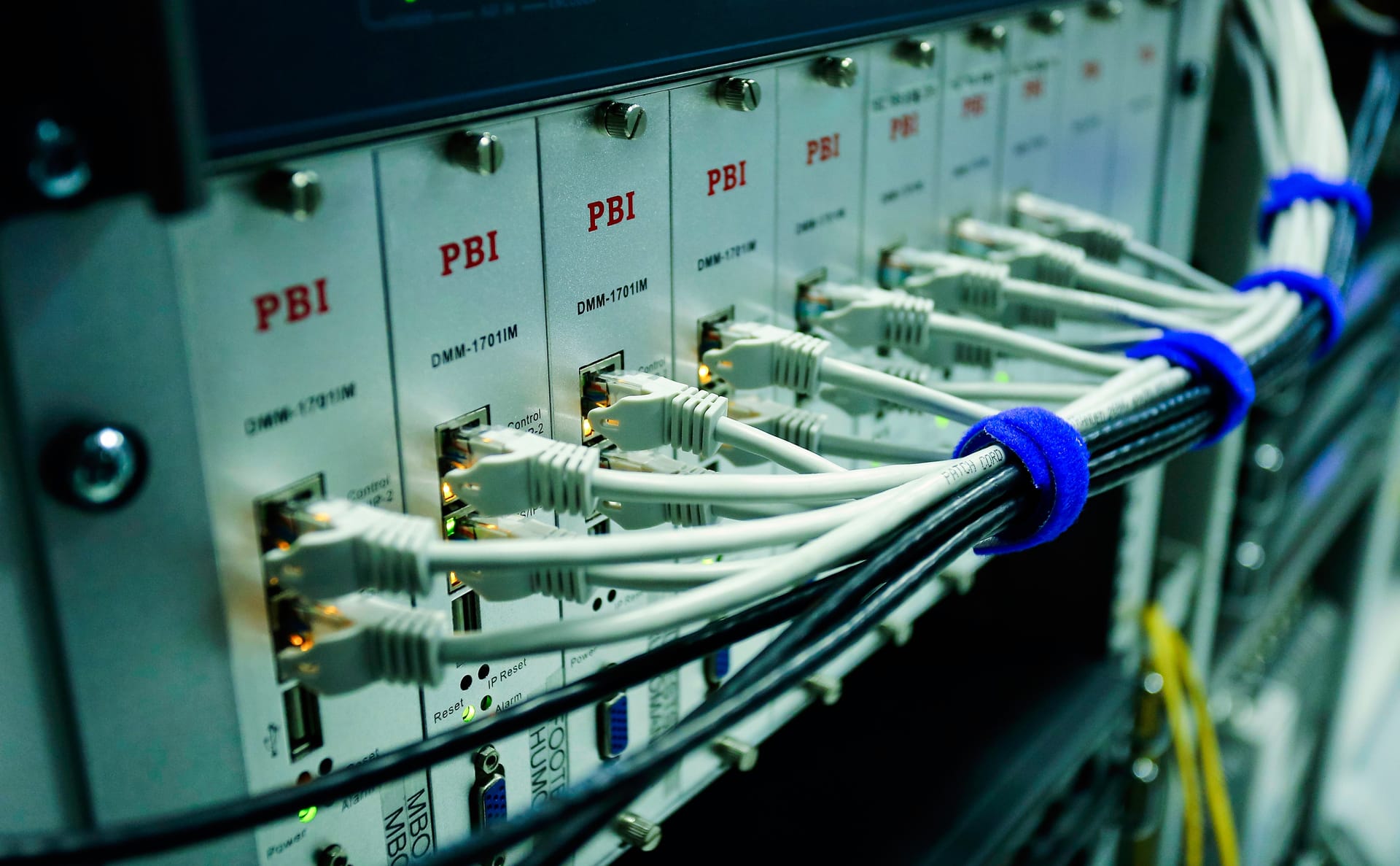 Neatly connected cables and equipment in a communications cabinet